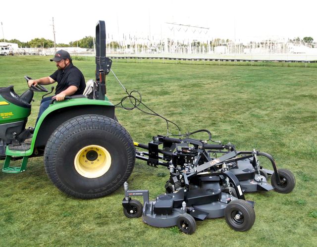 Pull behind outlet mower deck